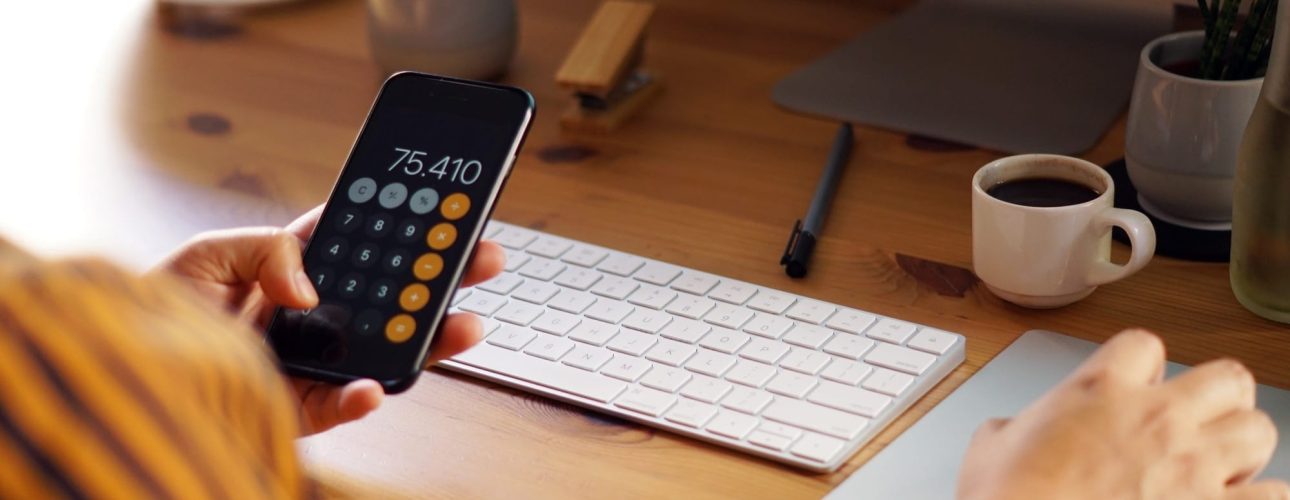 closeup-shot-entrepreneur-working-from-home-doing-calculations